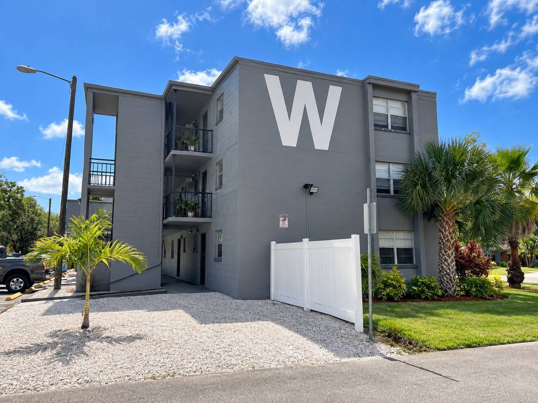 Building exterior with palm landscaping