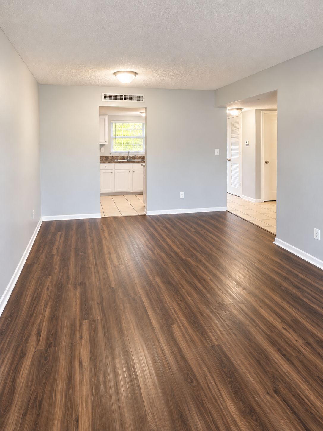 Open living space with kitchen and hallway sightlines